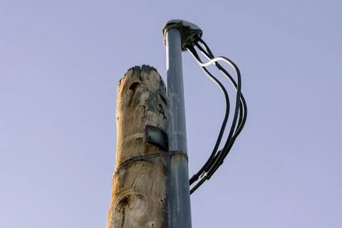 Utility pole and electrical lines against sky Stock Photos