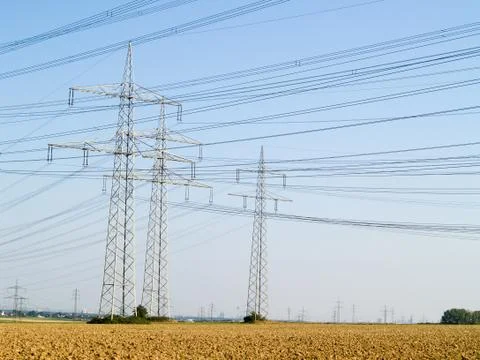 Utility pole on field Stock Photos