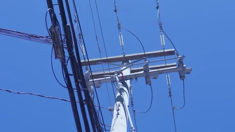 Utility pole with high voltage power lines and crossarms Stock Footage 336315095
