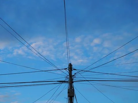 Utility pole supporting a massive, messy tangle of electrical, internet, an.. Stock Photos