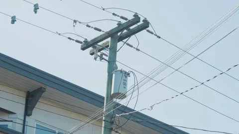 Utility pole transformer with electrical power lines on street Stock Footage 340233598