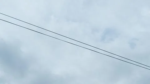 Utility power lines with cloud background Stock Photos