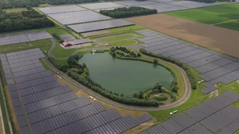 Utility scale solar farm beside rural lanes and fields, Netherlands Stock Footage 315850575