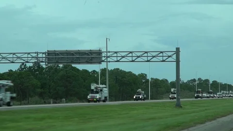 Utility Truck Convoy Heading into Disaster Zone co Video stock 124377053