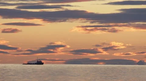 Utility Tug Ship Passing on Horizon During Sunset Clouds Stock Footage 12528267