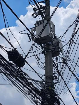Utility wires tangled on pole Stock Photos