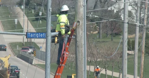 Utility Worker on Ladder - Using Fall Protection Stock Footage 128146363