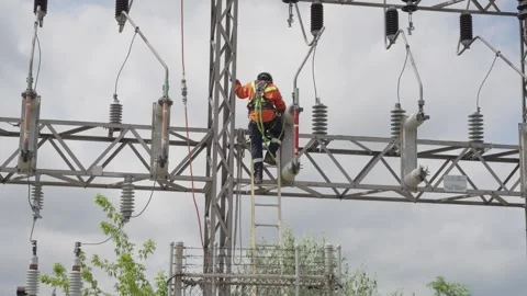 Utility Worker Performing High Voltage Maintenance Slow Motion Stock Footage 331058819