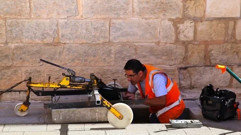 Utility worker programming digital laptop computer for calculation and drawing Stock Footage 72249956