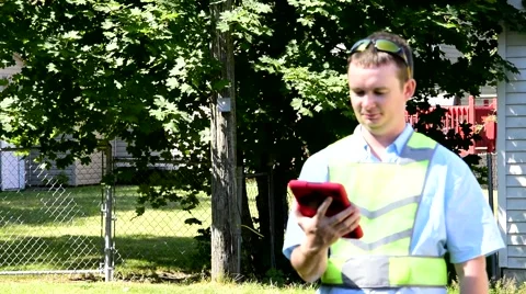 Utility Worker Utility maintenance repair searching house meter w Tablet 8 Stockbeeldmateriaal 67322888