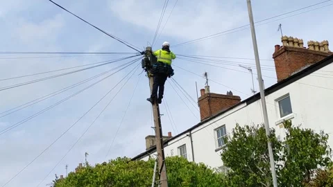Utility Worker Working on Overhead Cables in Warwick, England, UK (29 Sept 2026) Stock Footage 346710851