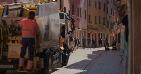 Utility workers driving through a pedestrian street in Rovinj Vídeo Stock 334336581