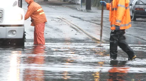 Utility Workers On Flooded Street Stock Footage 58012177