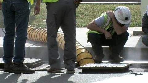 Utility Workers Working on Underground Vault Stock Footage