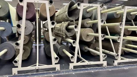 Utilizing Storage Racks for Media Rolls in Warehouses Ensures Maximum Opera.. Stock Photos