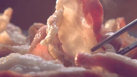 Utra Slow Motion Shot of Bacon Cooking Stock Footage 113333125