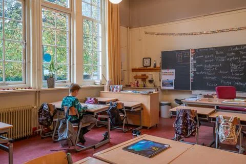 Utrecht, Netherlands - october 12 2021: A student sits in an otherwise empty Stock Photos