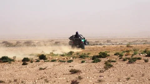 UTV Buggy and Dirt Bike Racing Together Side by Side Through Arid Tunisian Stock Footage 332895040