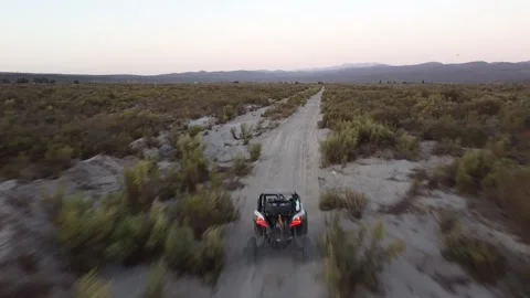 UTV racing on long stretch of dirt road in Mexico Stock Footage 166662021