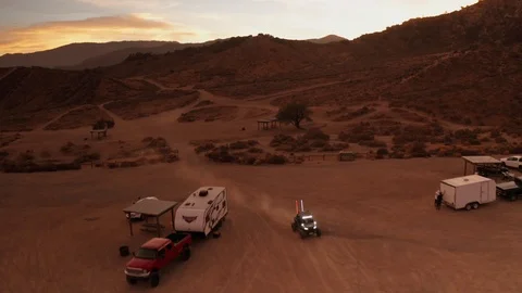 UTV riding back to camp at night with headlights on, Aerial Drone Footage Stock Footage 98715462