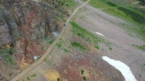 UTV on side of mountain drone follow 4K Yellowstone Stock Footage 144031526