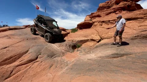 UTV / Side by Side crosses a rugged slick rock trail at Sand Hollow, Utah Stock Footage 301254450