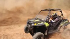 UTV's and ATV's Drifting a Berm Stock Footage