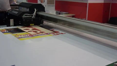 UV-LED hybrid printer IQDEMY, close up view of printing process Stock Footage 83372192