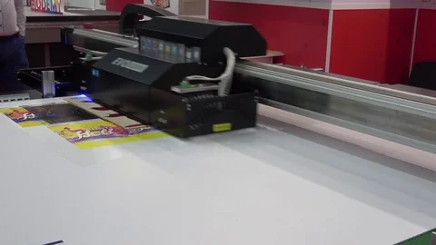UV-LED hybrid printer IQDEMY, close up view of printing process Stock Footage 83422311