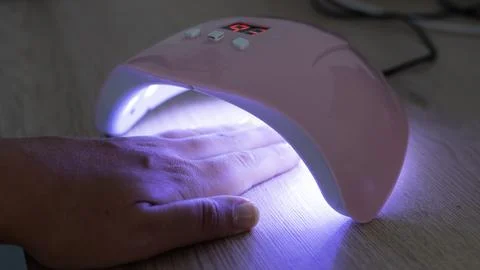 UV LED Nail Lamp Curing Gel Polish On Fingernails Stock Photos