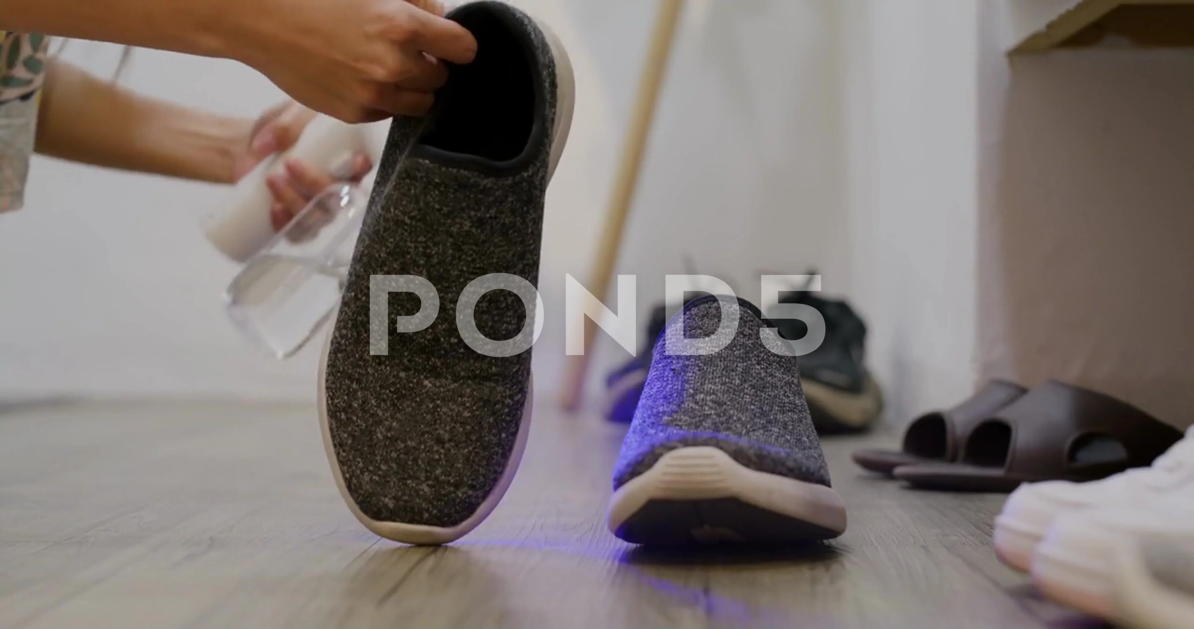 UV Light alcohol spray for cleaning pair of shoes Stock Photo - Alamy