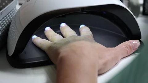 UV Nail Lamp Drying Gel Manicure at Salon Stock Footage 313229107