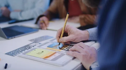 UX Designer, mobile app developer outlines an app on paper with template -UX Video stock 118218619