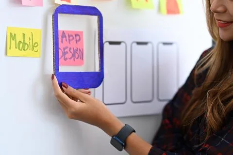 UX designer planning application template layout framework for mobile phone on Stock Photos