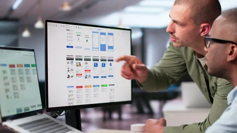 UX Designers Collaborating Closely To Improve User Interface Stock Footage 335452667