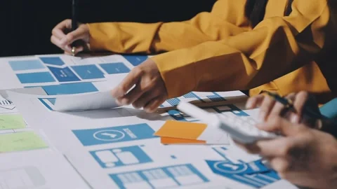 UX developer and ui designer brainstorming about mobile app interface wiref.. Stock Footage 293655560
