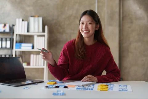 UX Developer and ui designer brainstorming about app interface design at modern Foto stock