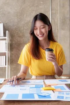 UX Developer and ui designer brainstorming about app interface design at modern Foto stock