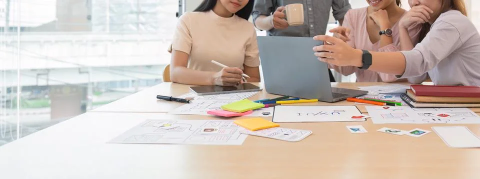 Ux developer and ui designer presenting and testing mobile app interface Stock Photos