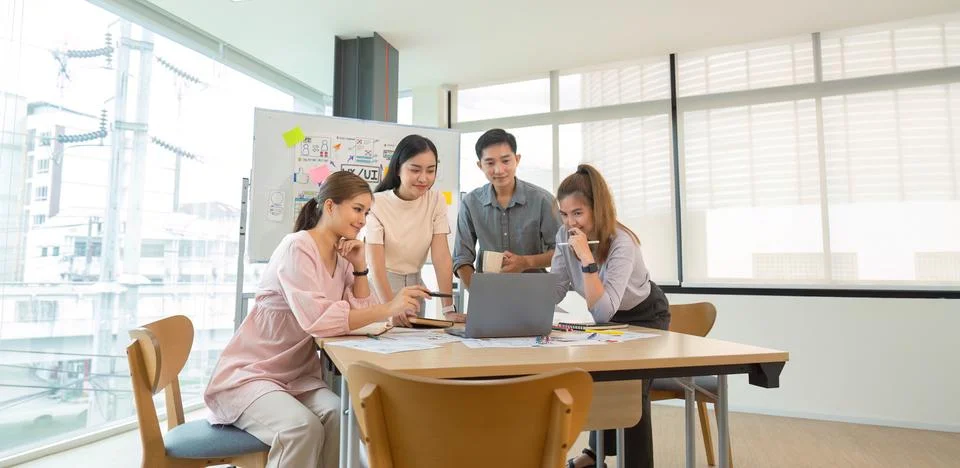 Ux developer and ui designer presenting and testing mobile app interface Stock Photos