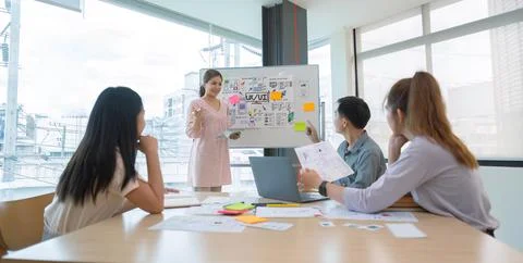 Ux developer and ui designer presenting and testing mobile app interface design Stock Photos