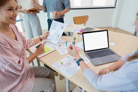 Ux developer and ui designer presenting and testing mobile app interface Stock Photos