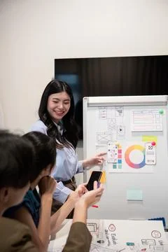 Ux developer and ui designer presenting and testing mobile app interface design Stock Photos