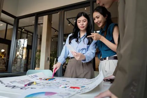 Ux developer and ui designer presenting mobile app interface design on Stock Photos