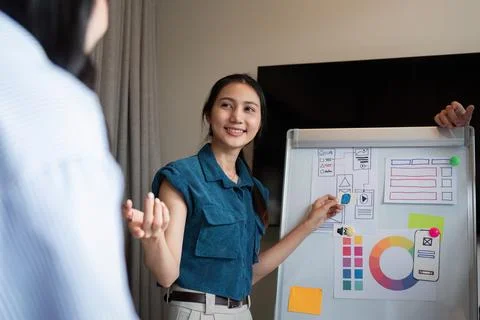 Ux developer and ui designer presenting and testing mobile app interface design Stock Photos