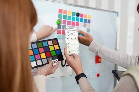 Ux developer and ui designer brainstorming interface wireframe design.Creative Foto stock