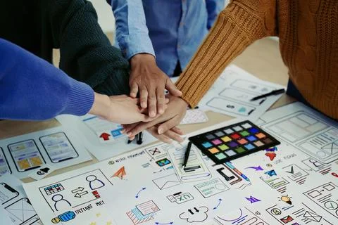 Ux developers and ui designers use augmented reality to brainstorm on mobile app Stock Photos