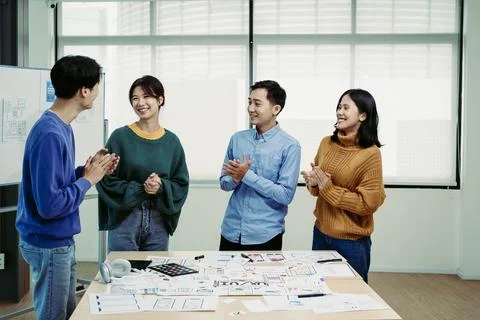 Ux developers and ui designers use augmented reality to brainstorm on mobile app Stock Photos