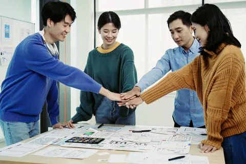Ux developers and ui designers use augmented reality to brainstorm on mobile app Stock Photos