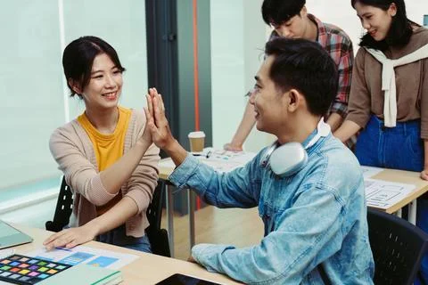 Ux developers and ui designers use augmented reality to brainstorm on mobile app Stock Photos